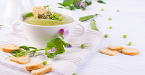 bowl of pea soup with crostini